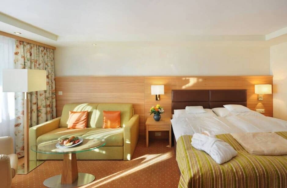 Guest suite with twin-share king bed and sofa seating area