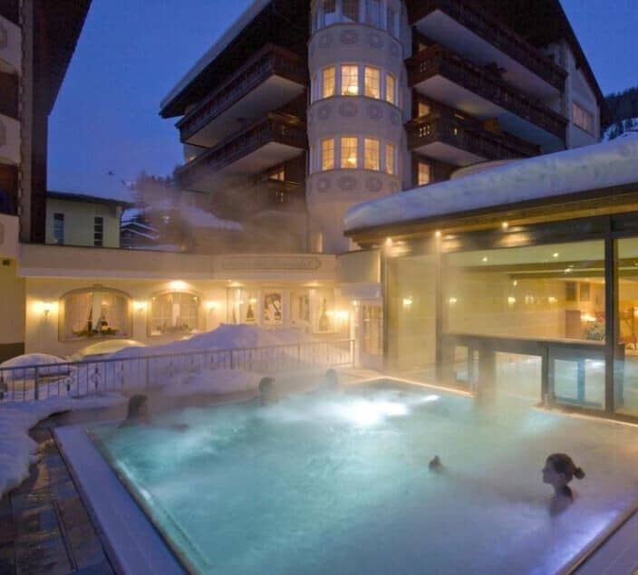 Heated outdoor pool with swim-through access to indoor spa area