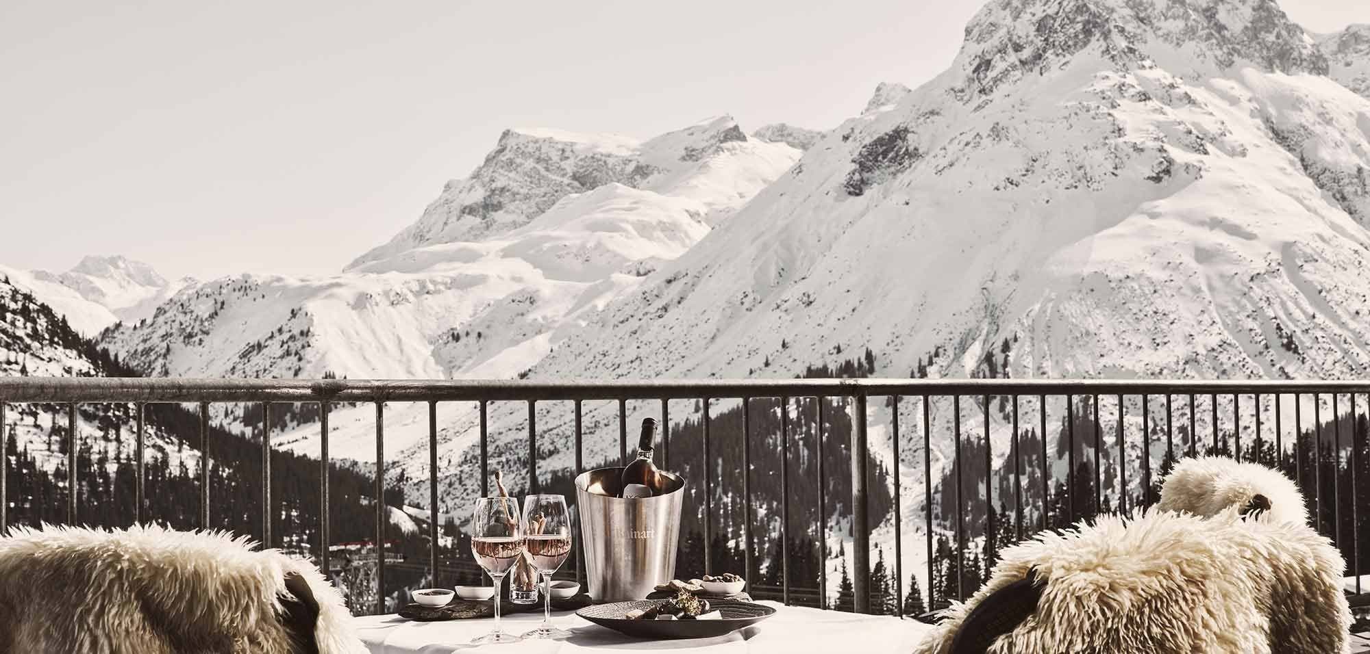 Private balcony with mountain views and sheepskin-lined seating
