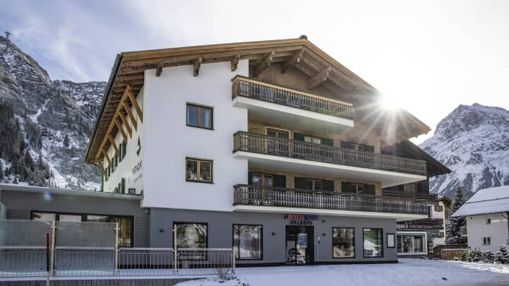 Chalet exterior with private balconies and on-site ski shop