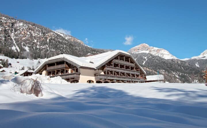 Mountain chalet exterior with balconies and direct ski-in access