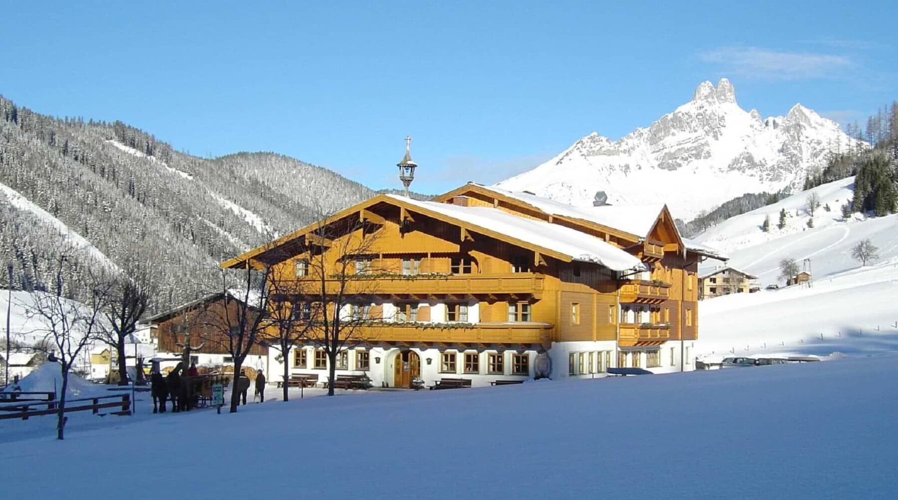 Chalet exterior with wrap-around balconies and mountain views