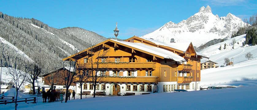 Chalet exterior with private balconies and direct mountain views