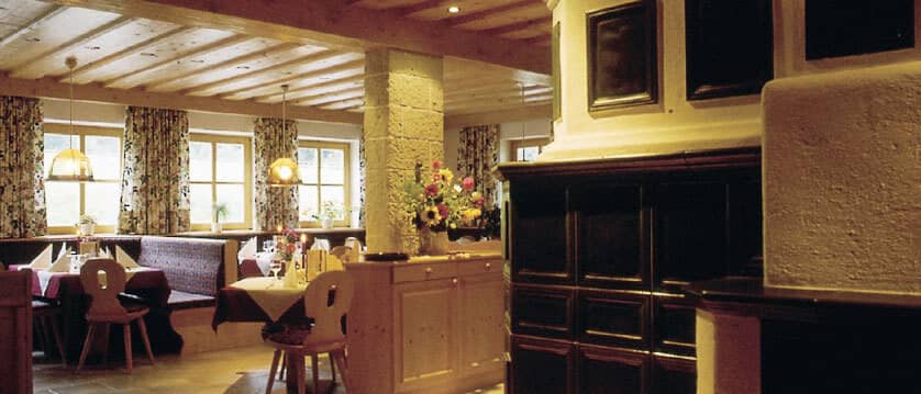 Dining area with booth seating and traditional timber-beamed ceilings