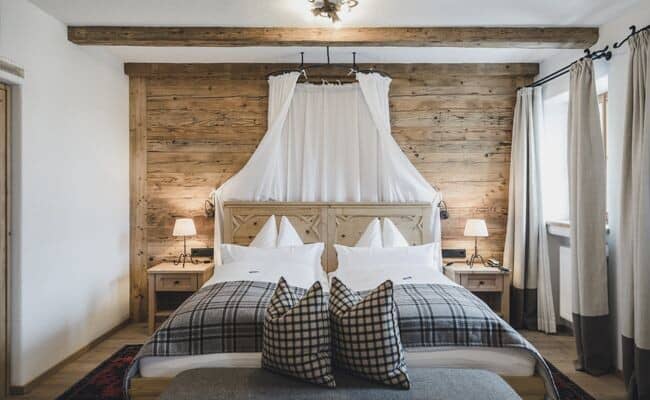Bedroom with two twin beds and reclaimed wood accent wall