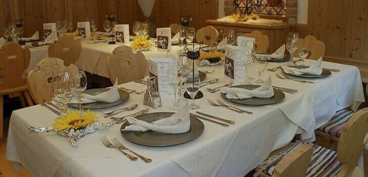Dining area with large group seating and traditional heart-cutout chairs