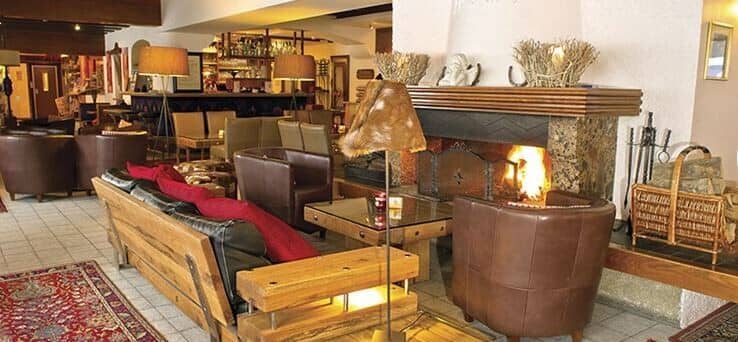 Lounge with wood-burning fireplace and leather club chairs