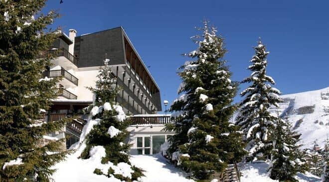 Ski-in/ski-out chalet exterior with private balconies and mountain views