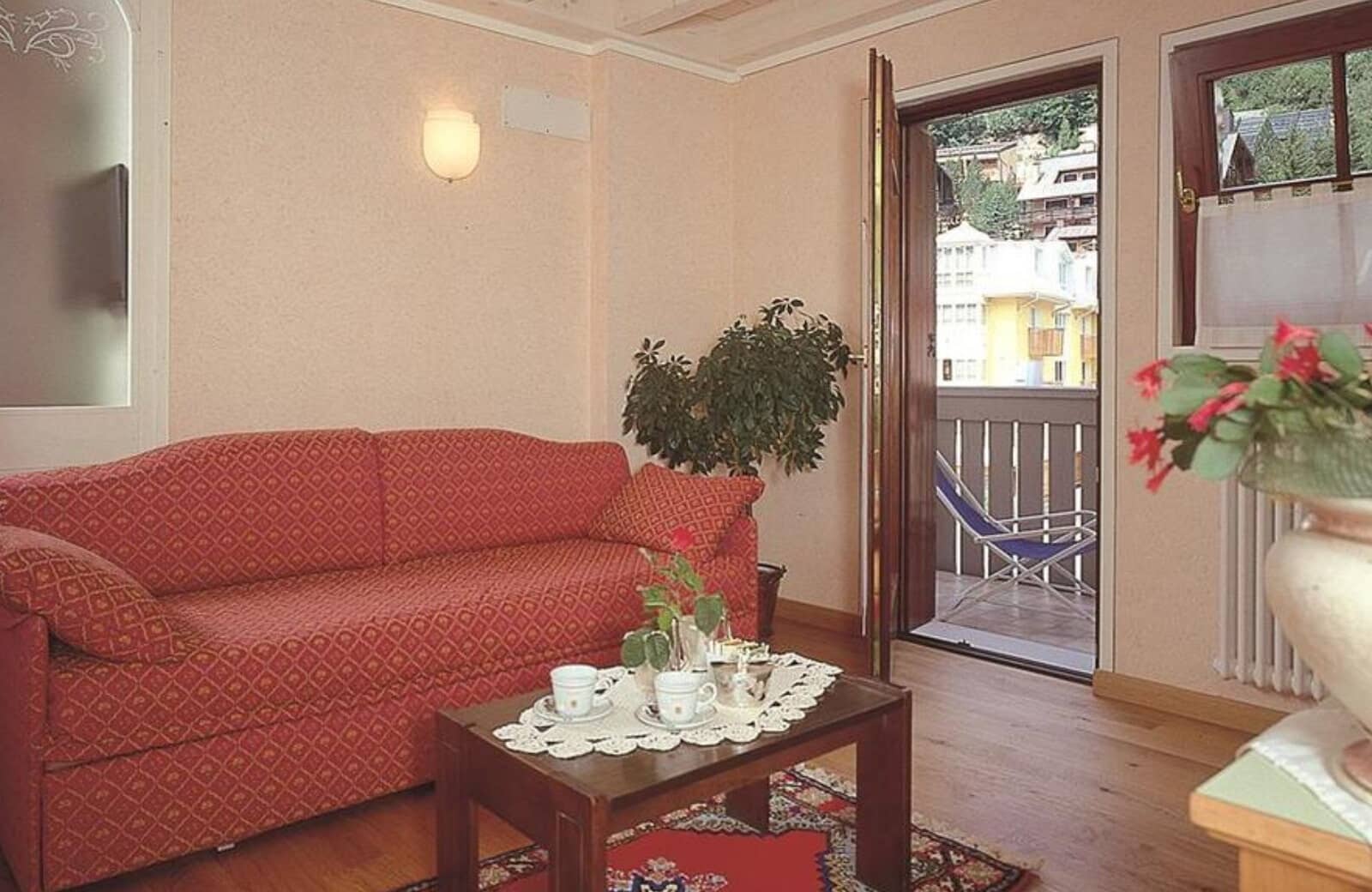 Living area with sofa bed and balcony access