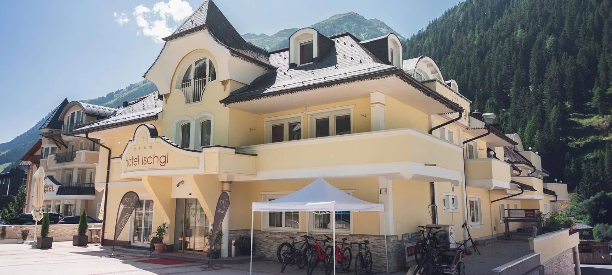 Hotel exterior with mountain views and bicycle storage area