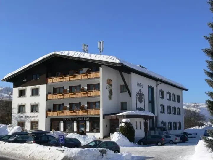 Hotel exterior with private balconies and on-site parking