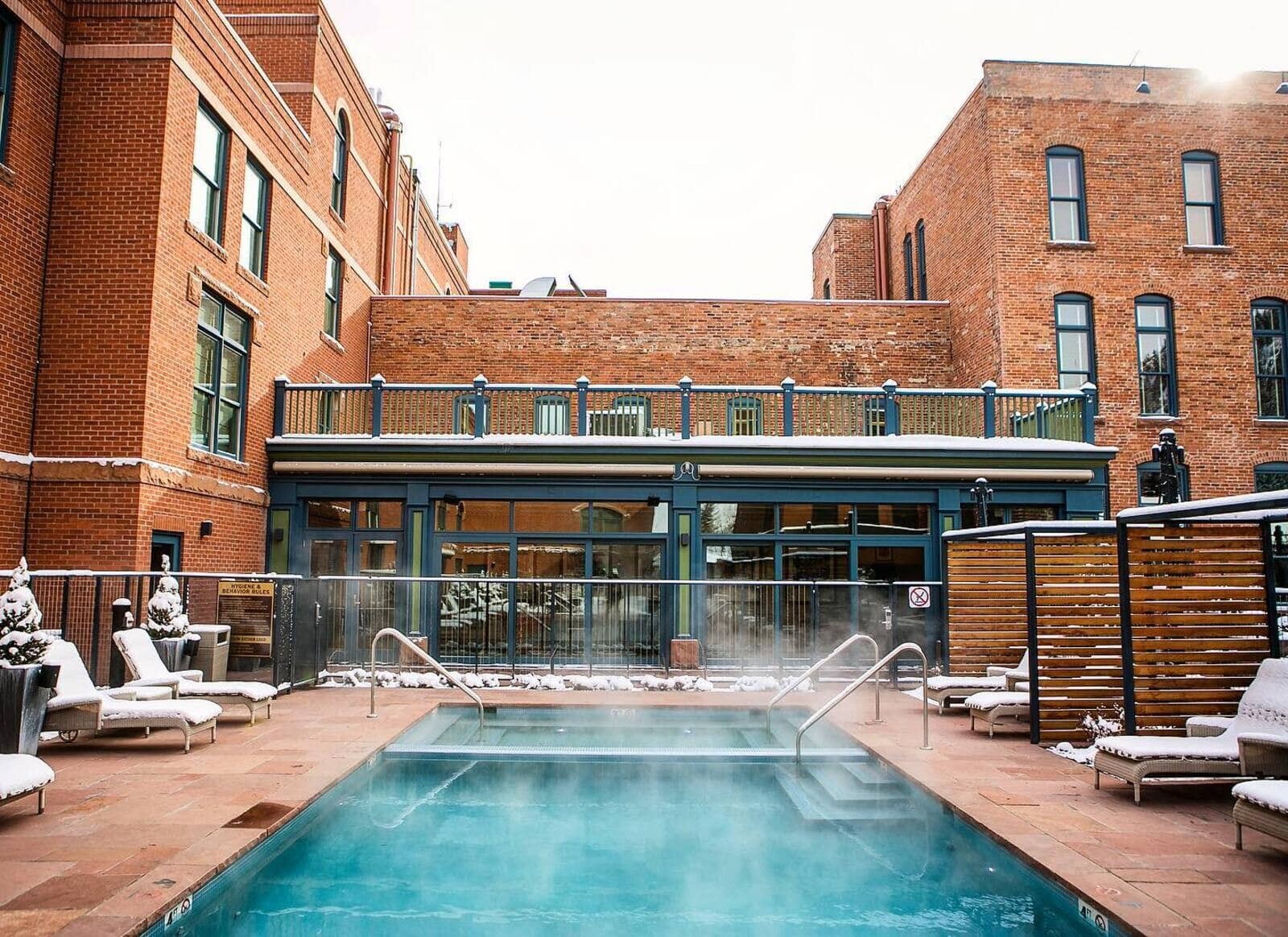 Heated outdoor pool and hot tub with lounge seating