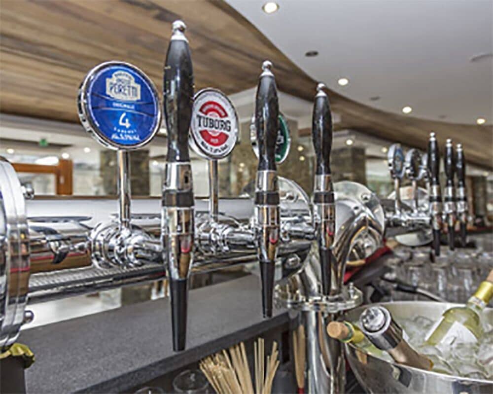 Private bar area with multiple beer taps and wine ice bucket