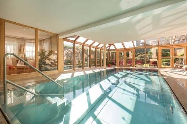 Indoor heated pool with solarium windows and integrated entry steps