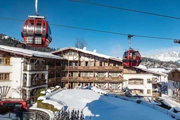 Ski-in/ski-out chalet exterior with gondola access and private balconies