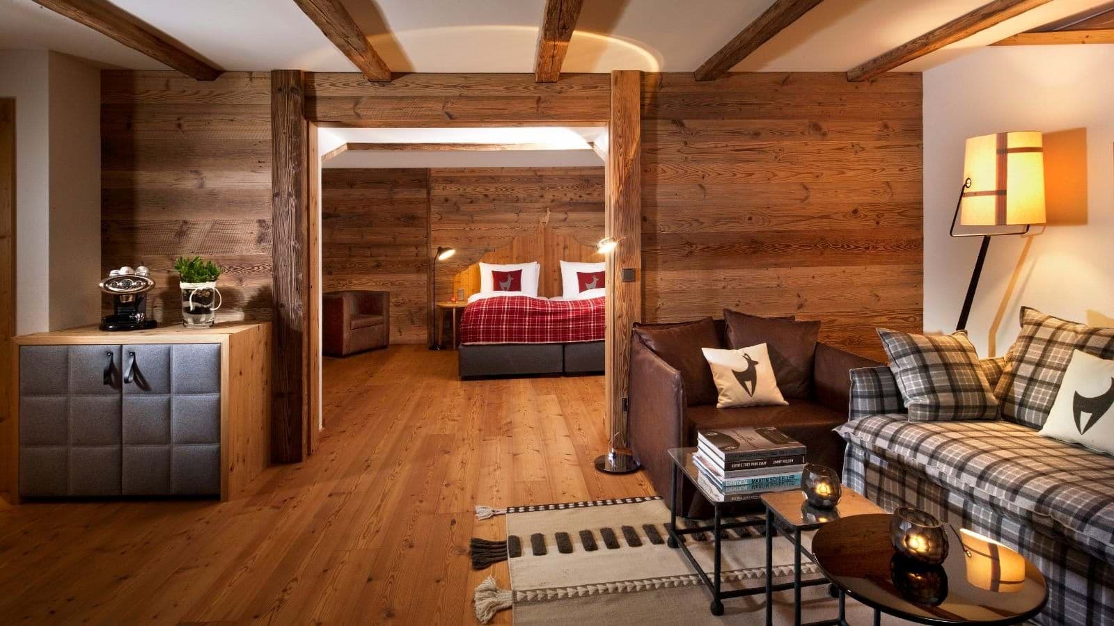 Living area with coffee station and adjoining bedroom with king bed