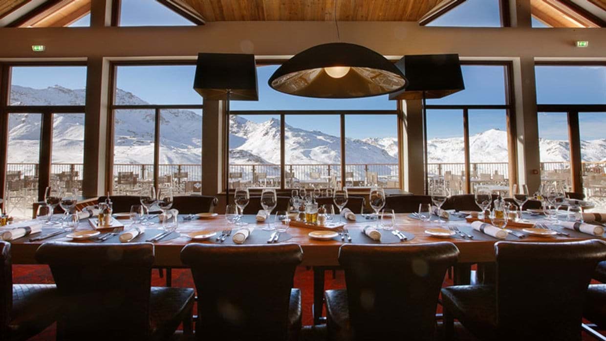 Dining table seats 14 with panoramic mountain and terrace views