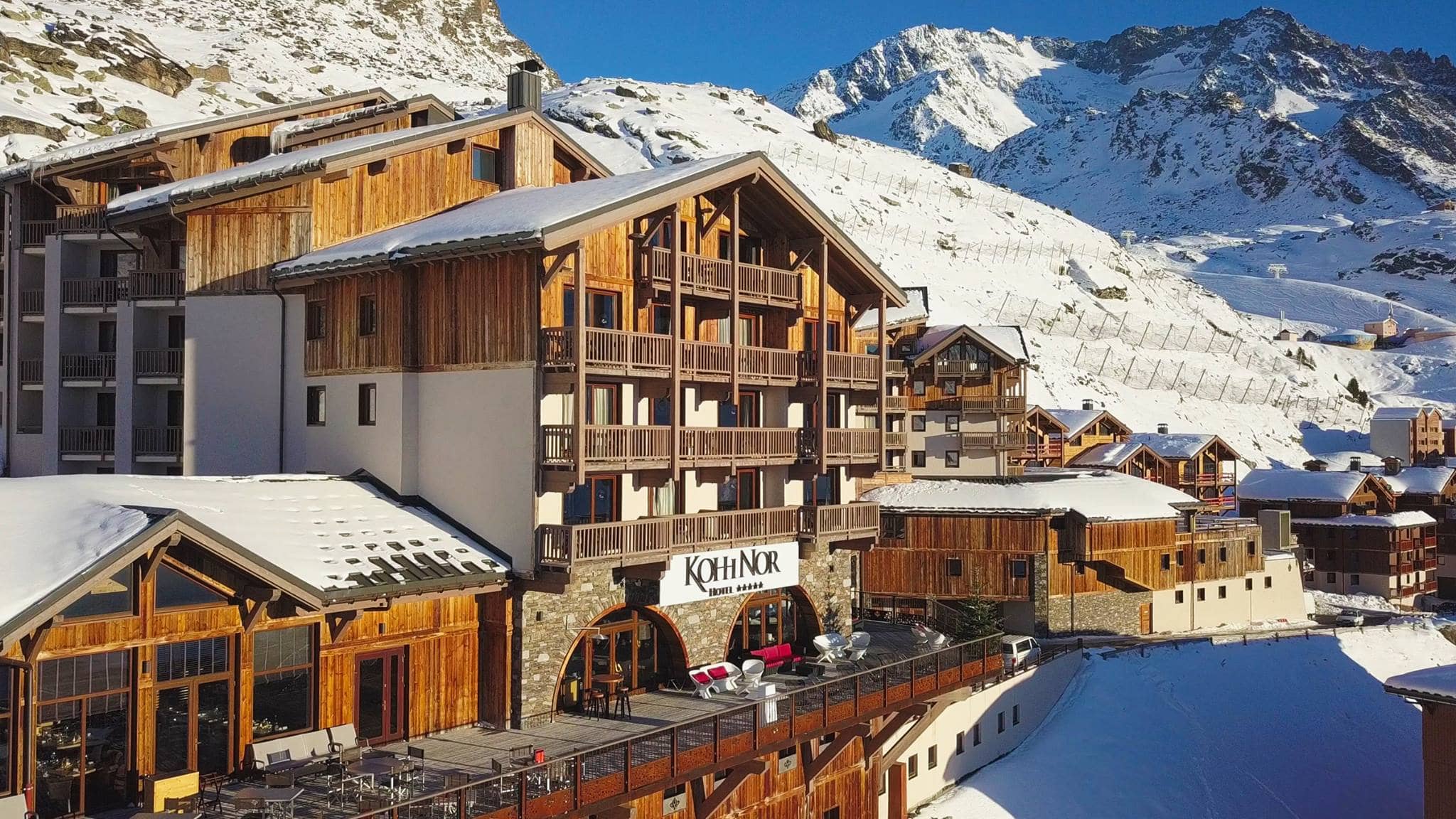 Ski-in, ski-out chalet exterior with sun terrace and mountain views