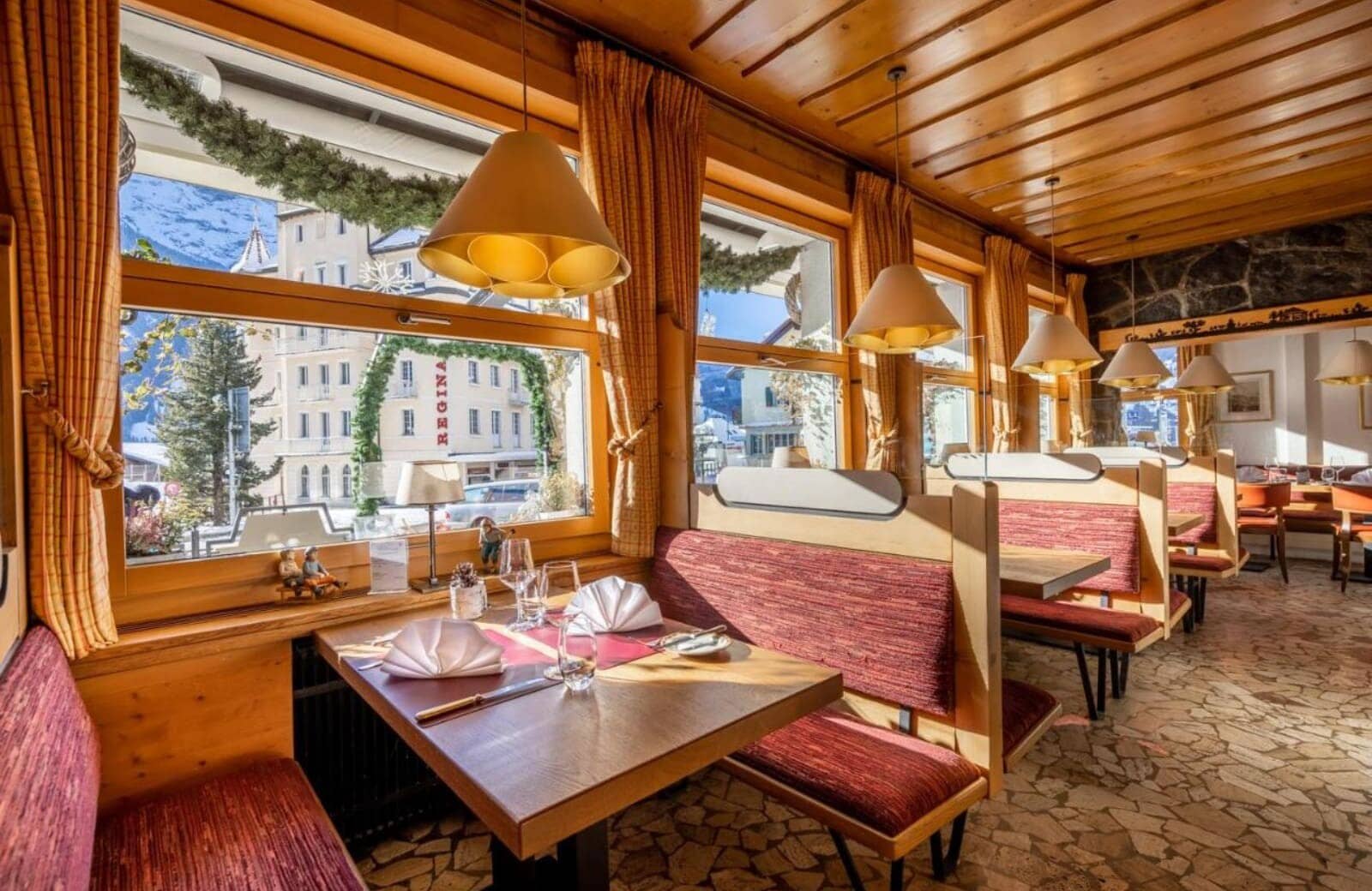 Dining area with booth seating and mountain village views