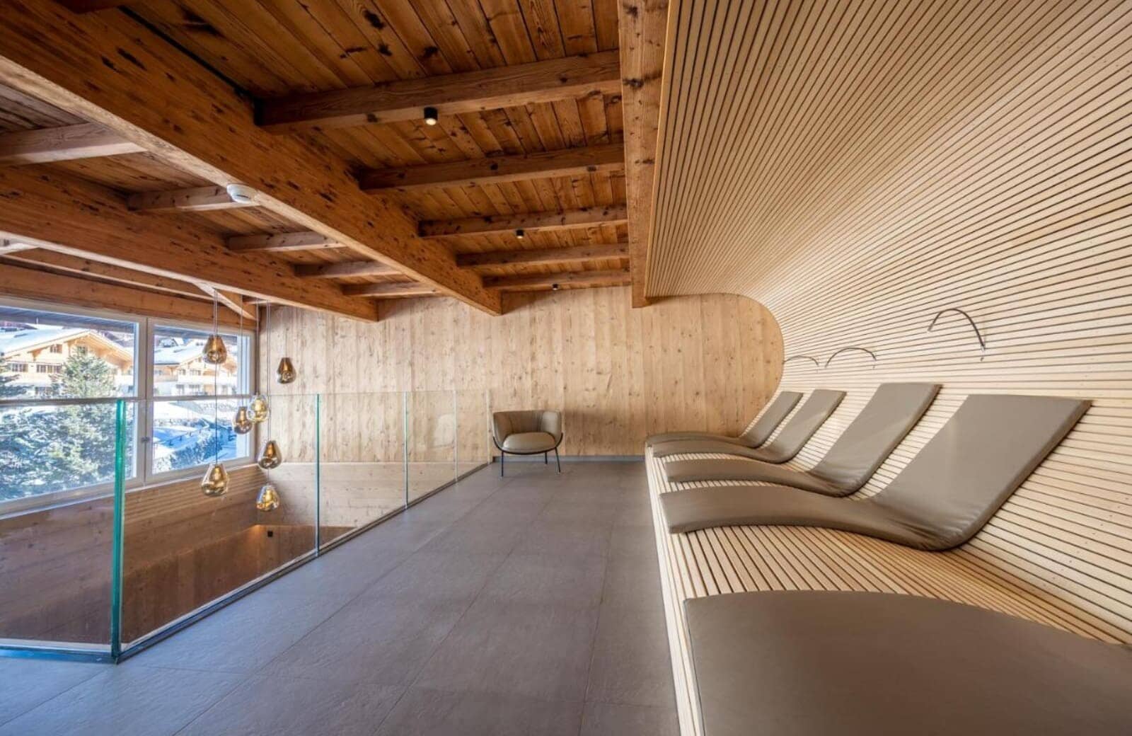 Mezzanine relaxation area with integrated loungers and village views