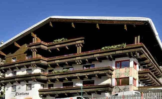 Chalet exterior with multiple private balconies and traditional timber eaves