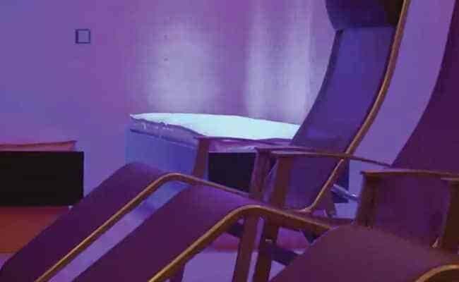 Spa relaxation room with ergonomic lounge chairs and ambient lighting