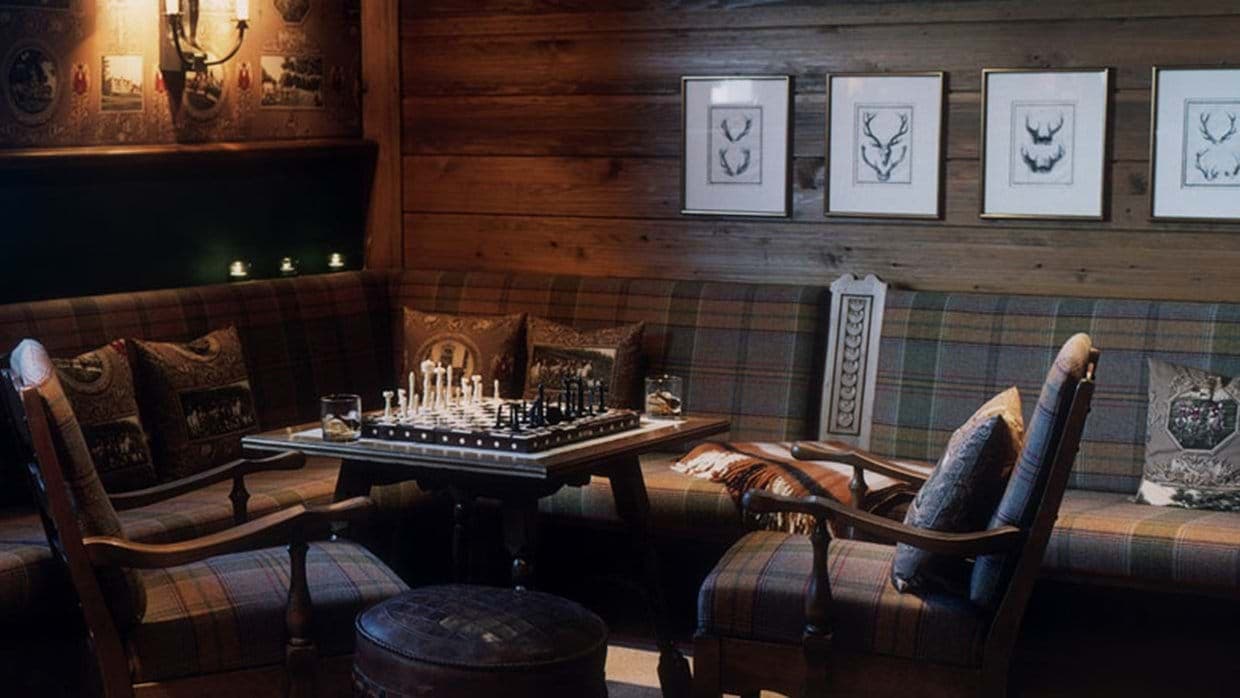 Lounge area with built-in banquette seating and chess table