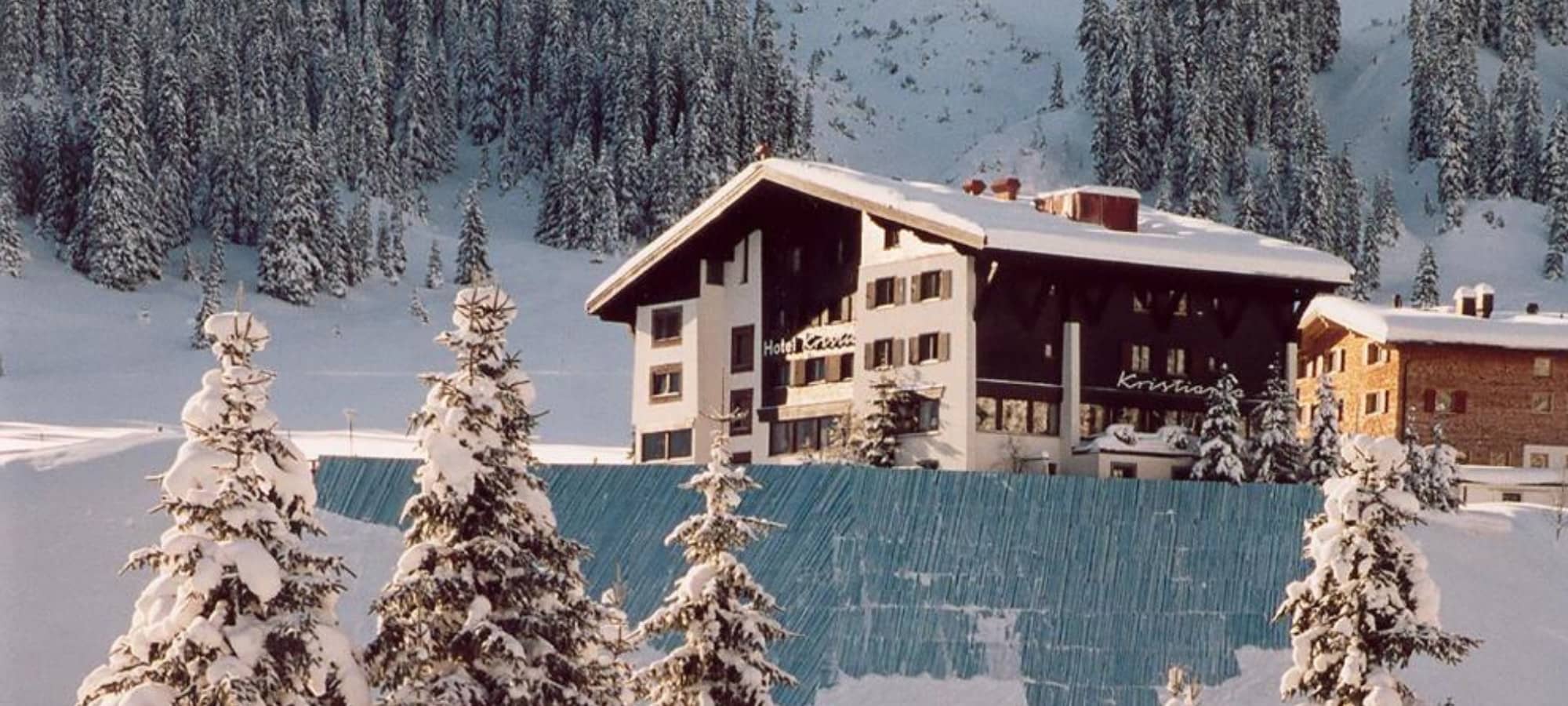 Ski-in/ski-out chalet exterior with direct forest access