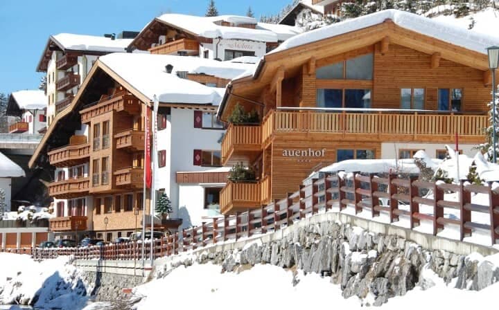 Chalet exterior with private balconies and mountain views
