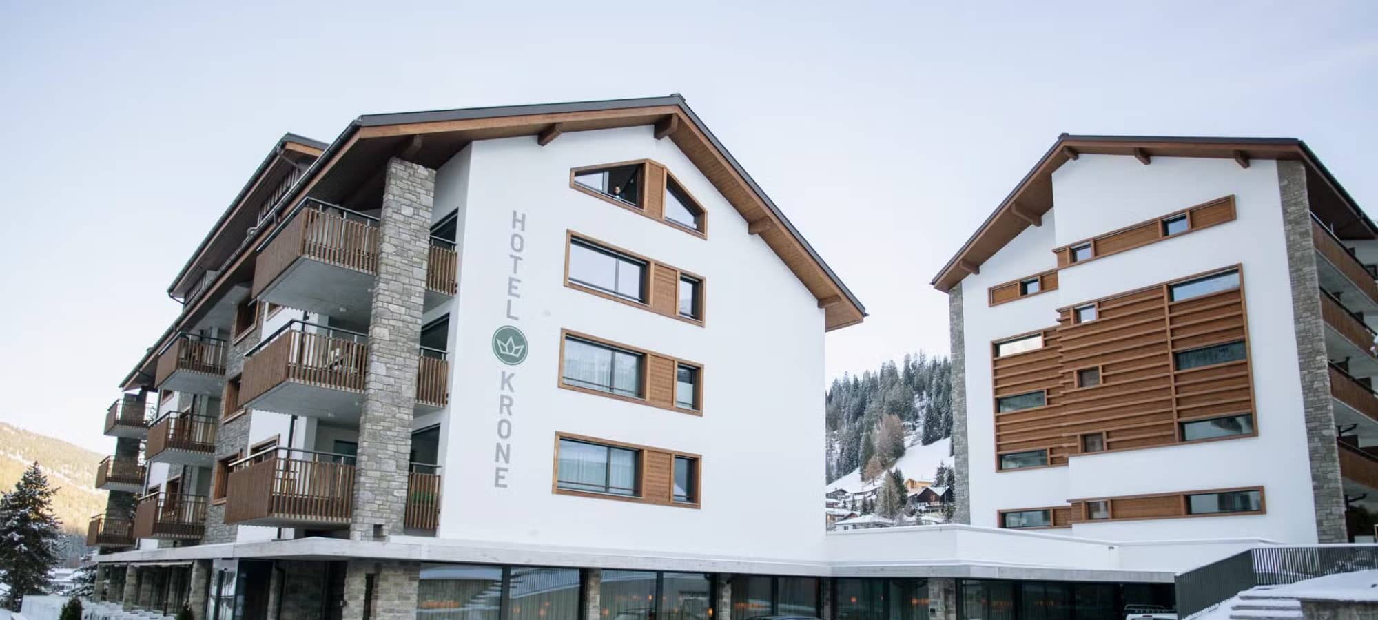 Hotel exterior with private balconies and mountain valley views