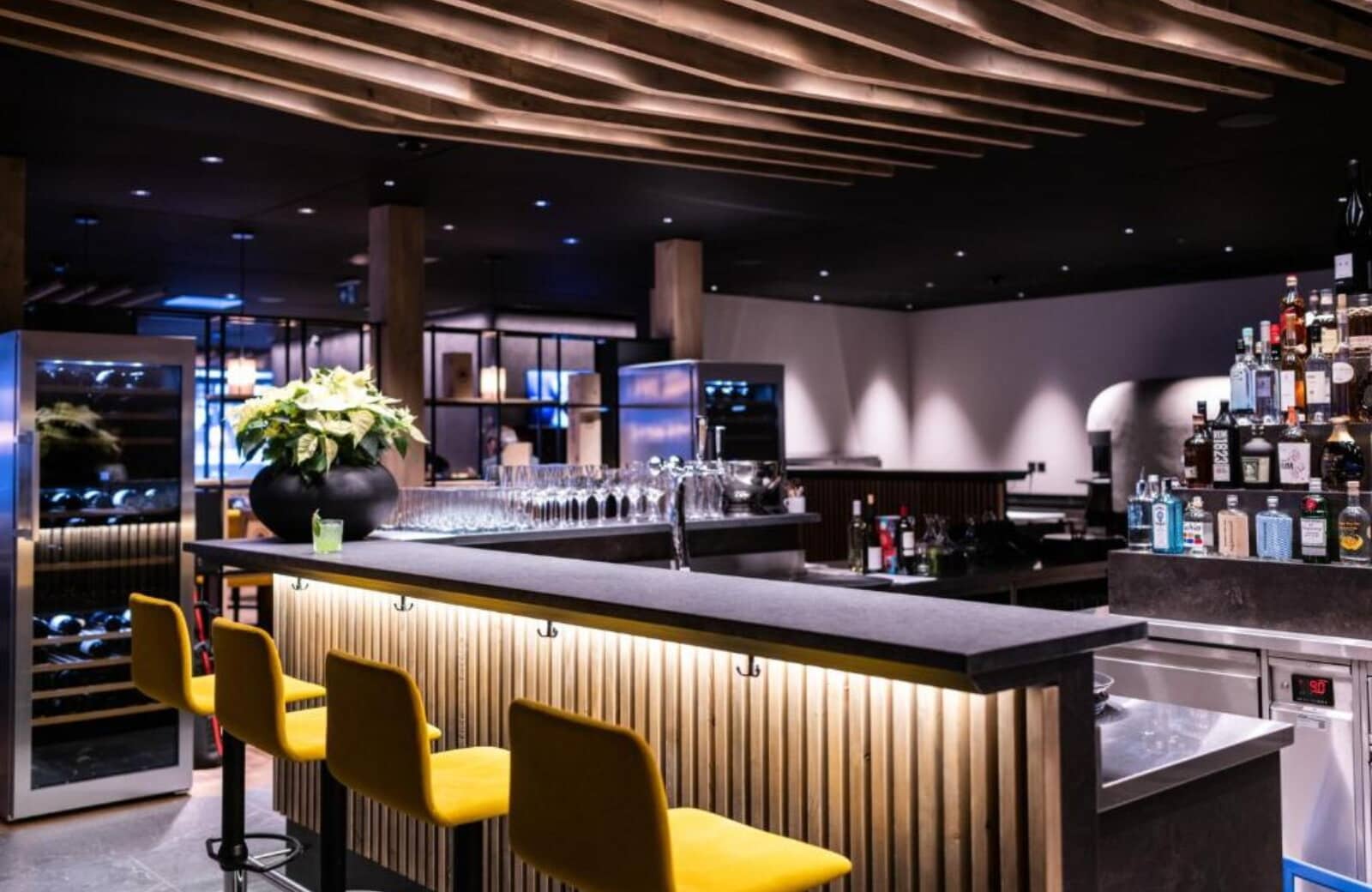 Wine bar with temperature-controlled fridge and counter seating for four