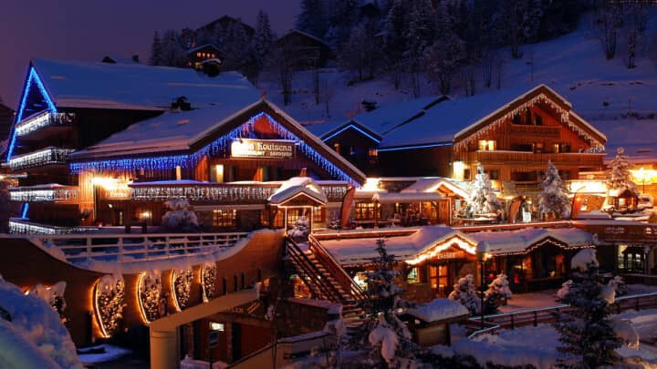 Evening exterior showing proximity to village restaurants and local shops