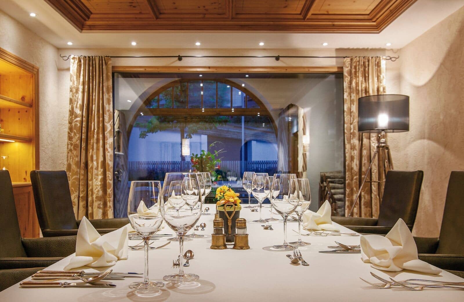 Dining room with coffered wood ceiling and seating for 8