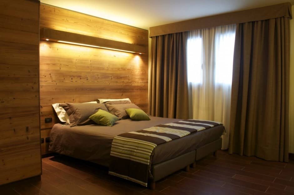 Bedroom with queen bed and reclaimed wood accent wall
