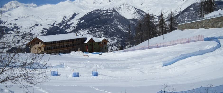 Ski-in/ski-out chalet exterior with direct access to groomed mountain trails