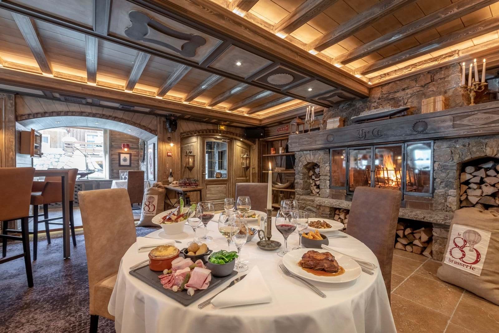 Dining area with wood-burning fireplace and coffered timber ceilings