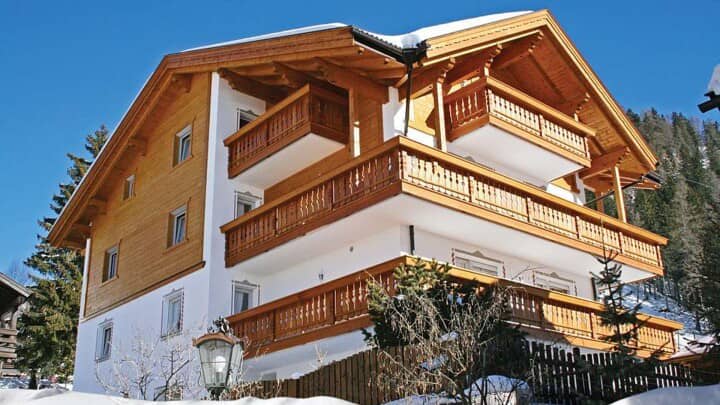 Chalet exterior with three levels of private wrap-around balconies