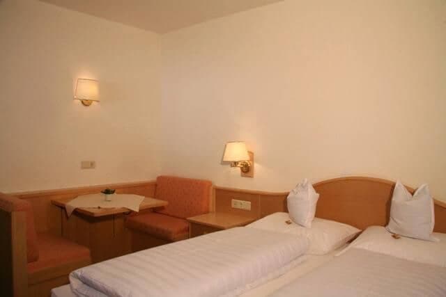 Bedroom with two twin beds and small dining nook