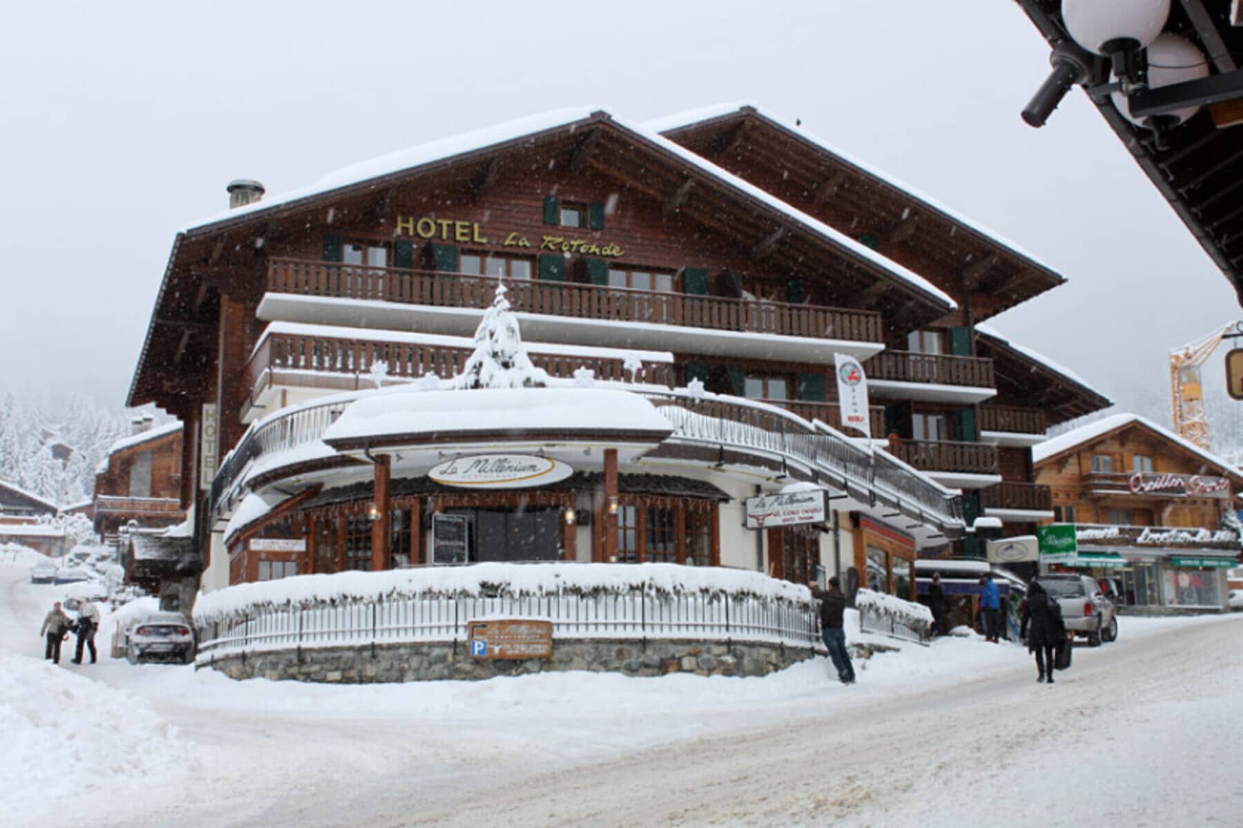 Chalet exterior with ground-floor restaurant and private balconies