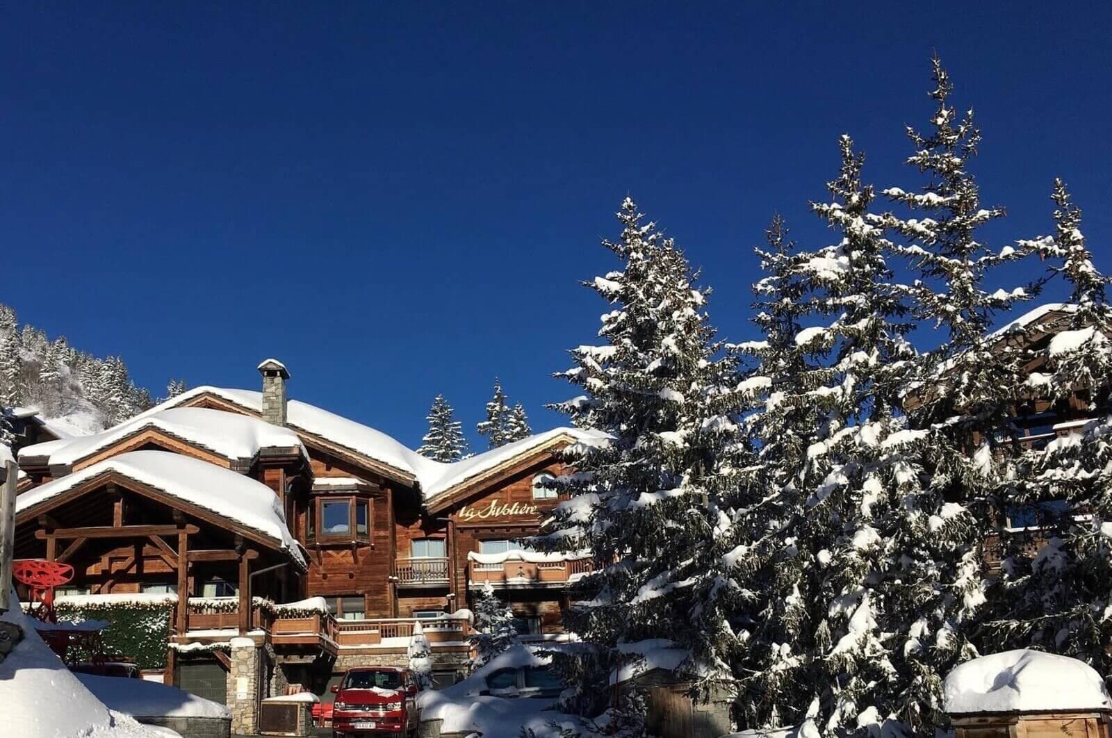Ski-in, ski-out timber chalet with driveway parking and private balconies