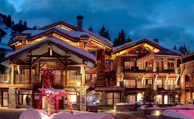 Ski-in/ski-out chalet with multiple private balconies and stone-paved entrance