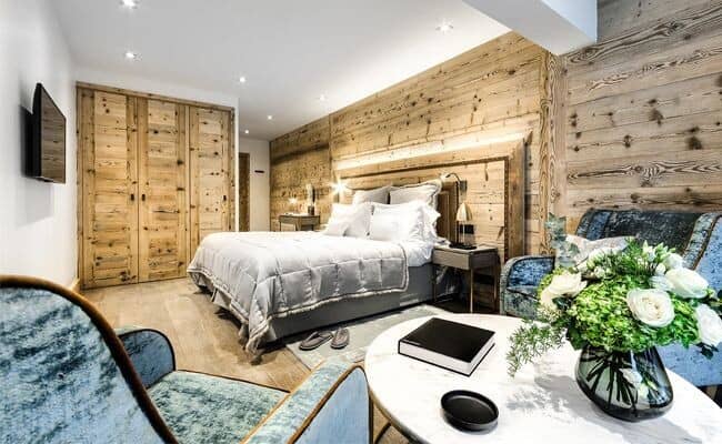 Guest bedroom with king bed and reclaimed wood walls