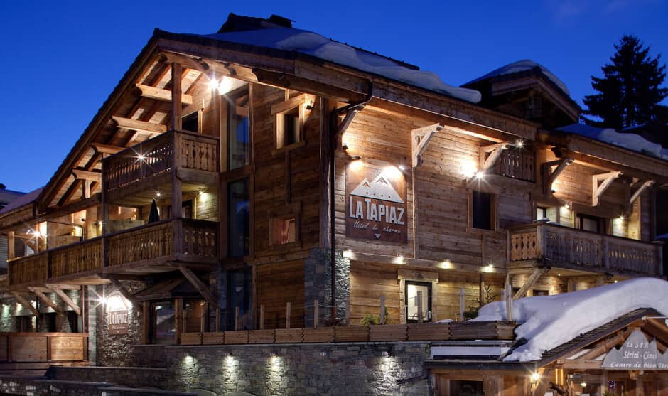 Chalet exterior with timber balconies and direct ski-in access