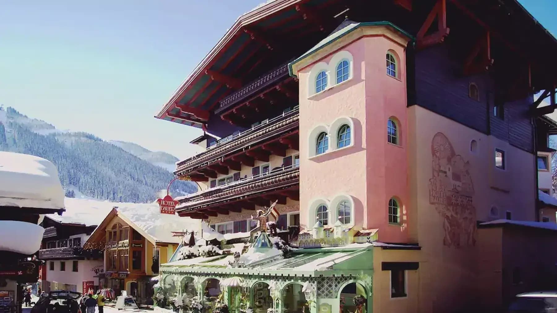 Chalet exterior featuring private balconies and immediate access to alpine village shops