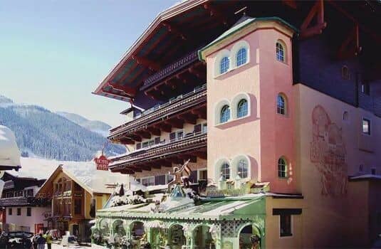 Ski-in/ski-out lodge exterior with mountain views and private balconies