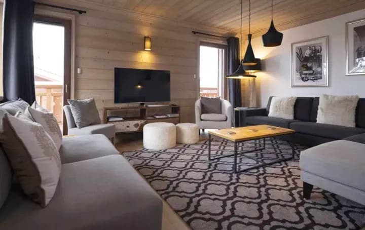 Living area with Smart TV and balcony access