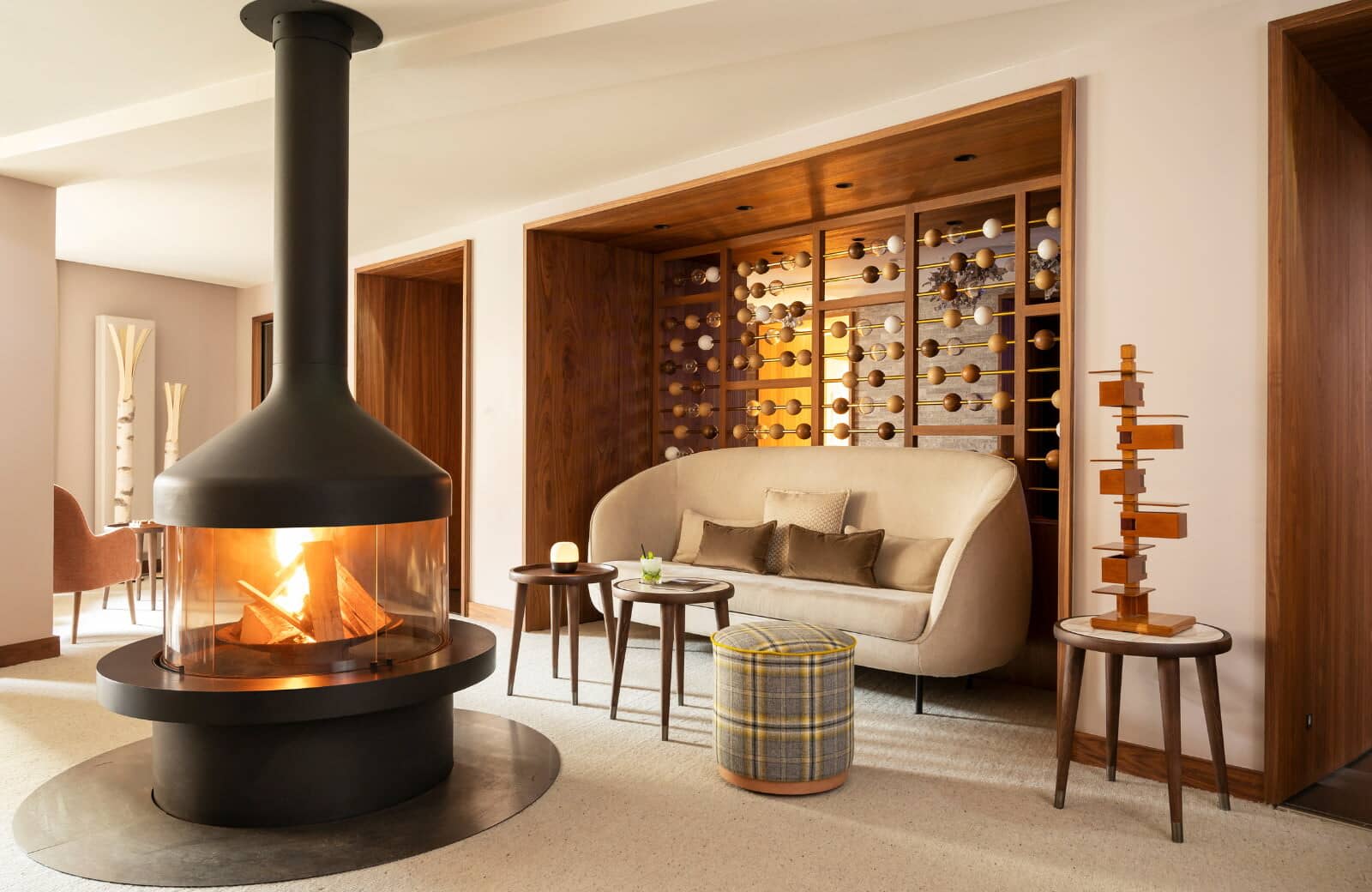 Lounge area with central wood-burning fireplace and built-in alcove seating