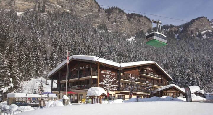 Ski-in/ski-out lodge exterior located directly beneath the mountain cable car
