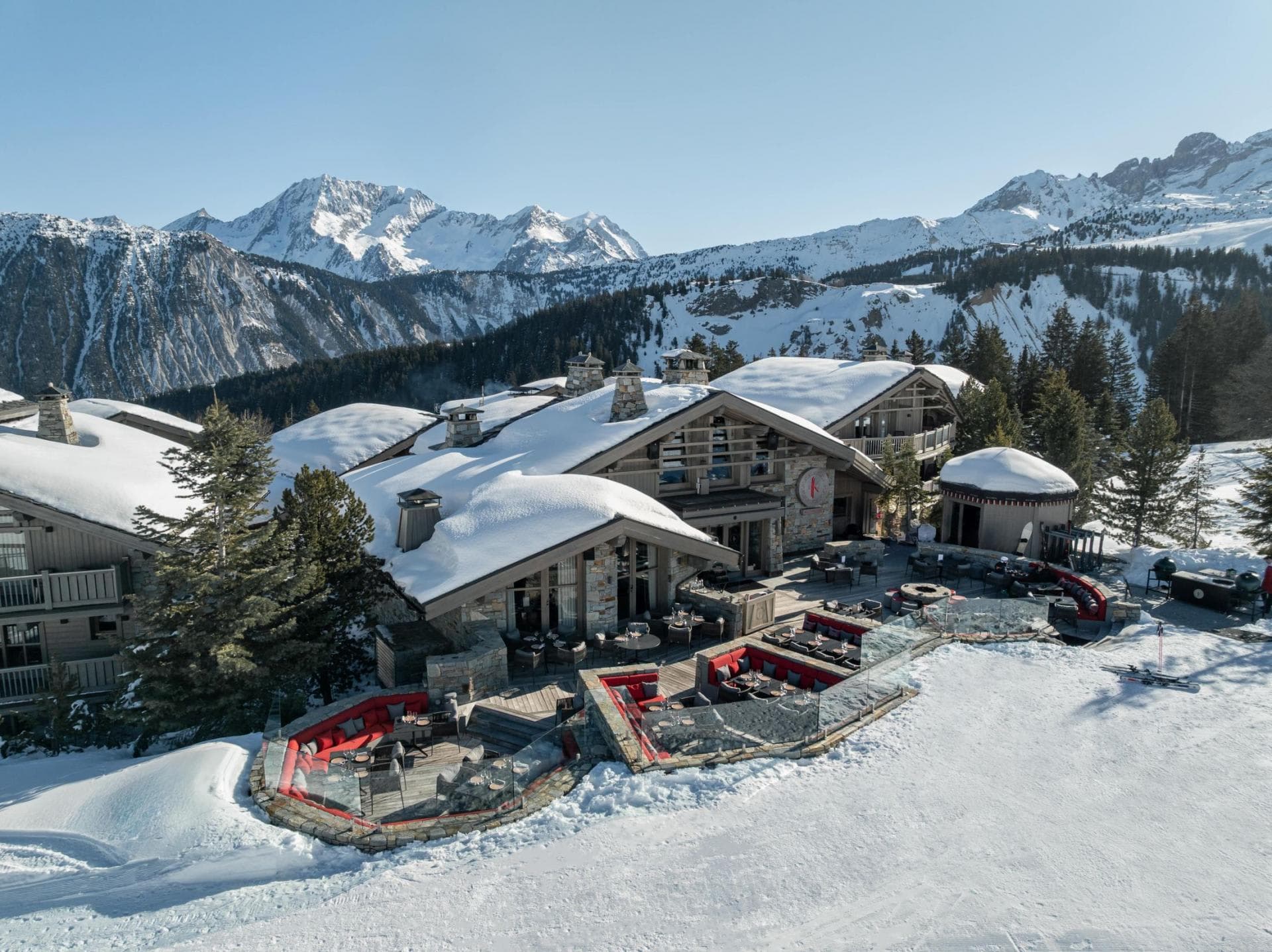Ski-in/ski-out chalet with mountain-view terrace and fire pit seating