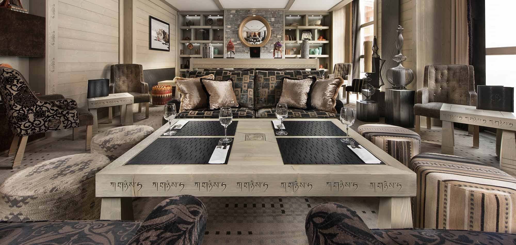 Lounge area with low square dining table and seating for 10